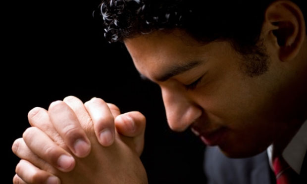 Man praying (iStock)
