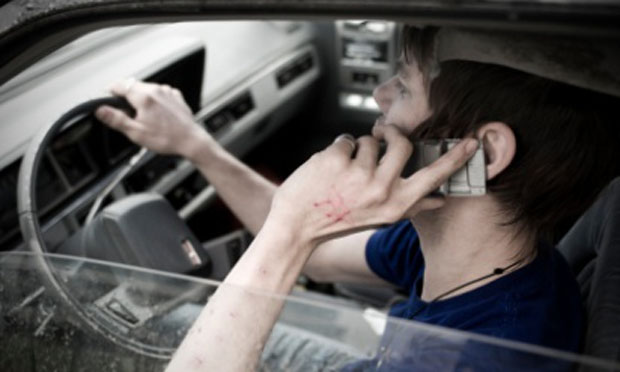 Driver talking on a cell phone (iStock)