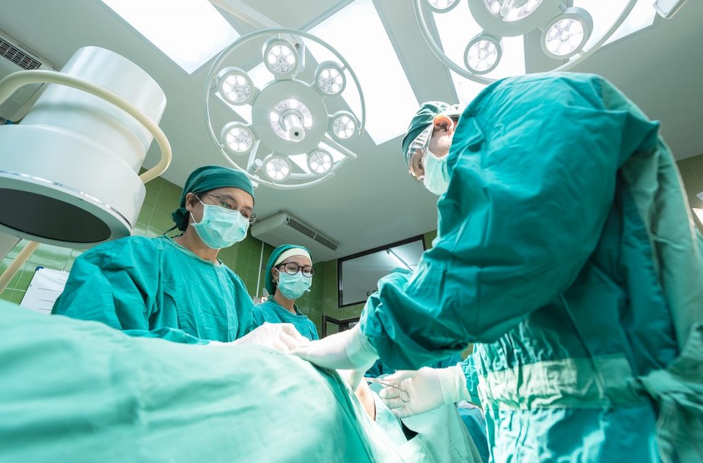 Physicians perform medical procedure