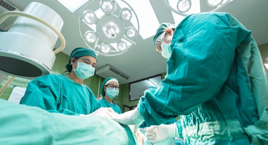 Physicians perform medical procedure