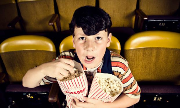 Kid at the movies (iStock)