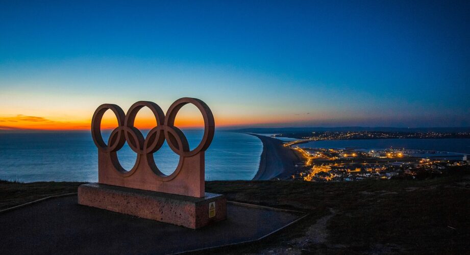 Olympic rings monument at night