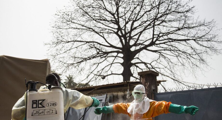 Ebola burial team disinfecting
