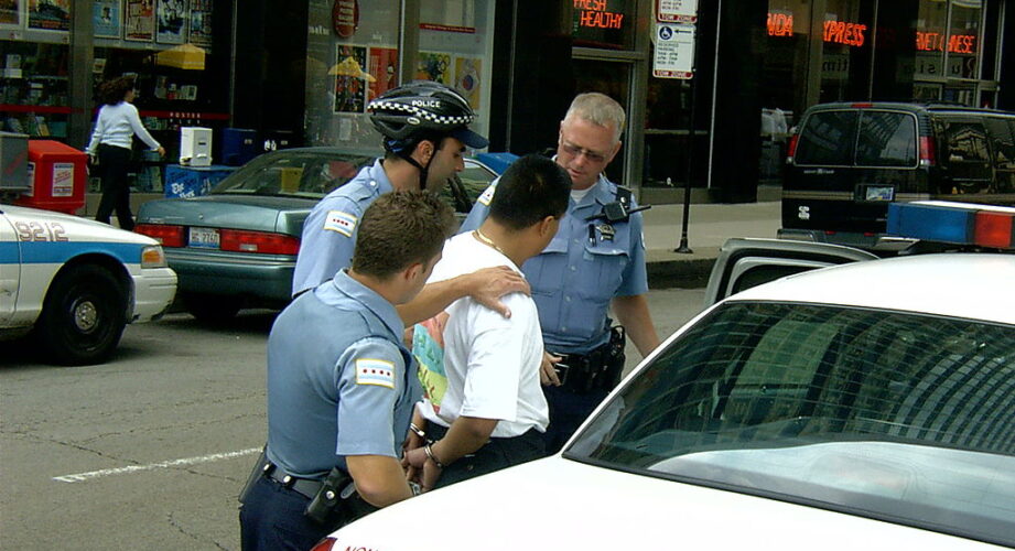 Man being arrested by police