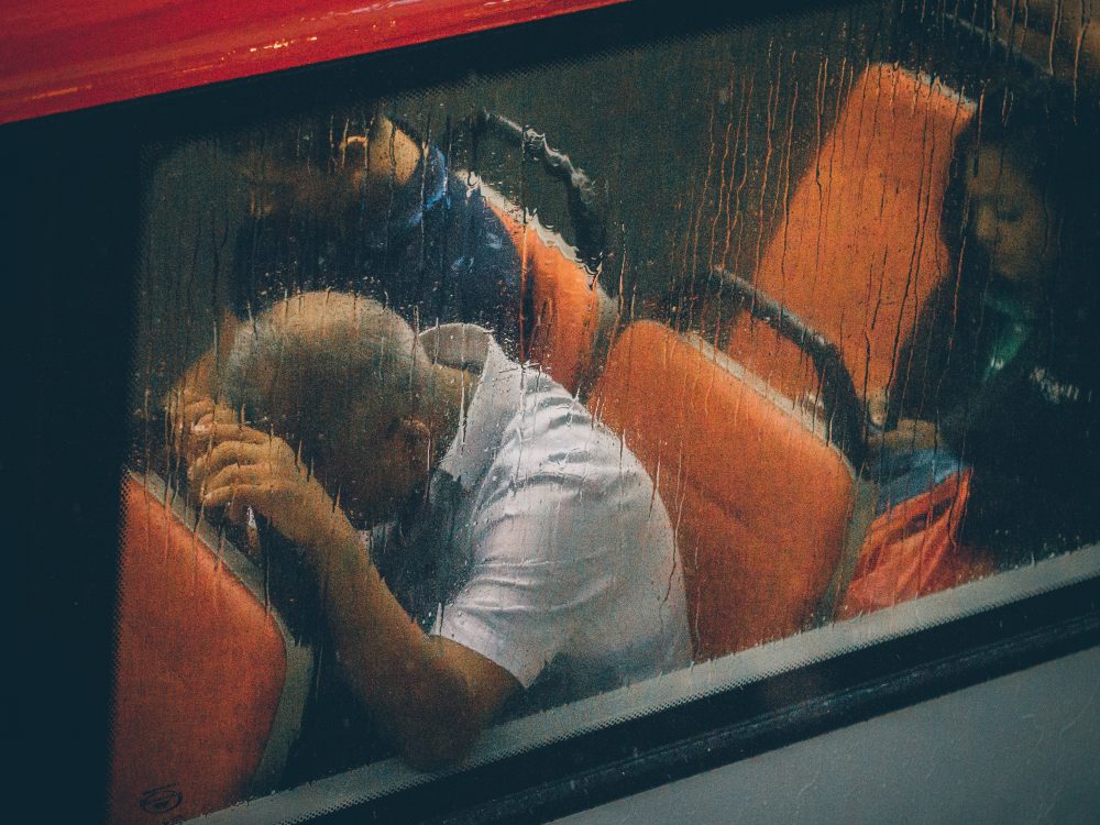man on bus in rain