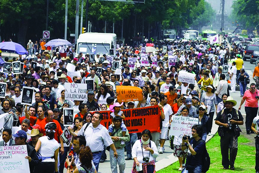 Hundreds of Mexican journalists silently marched in downtown Mexico City in protest of the kidnappings, murder and violence against their peers throughout the country.