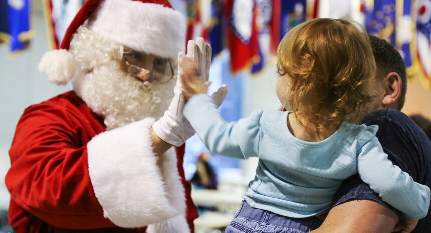 Santa interacting with small child