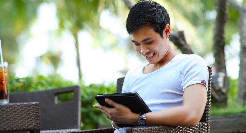 Young man using tablet.