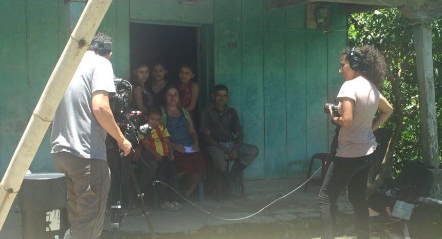 Journalists Daffodil Altan and Andrés Cediel prepare to interview a family in Guatemala.