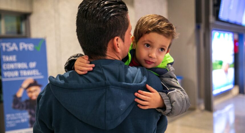 Julio holds his son Brayan, 4, at Austin-Bergstrom International Airport in Austin. (Ilana Panich-Linsman for ProPublica)