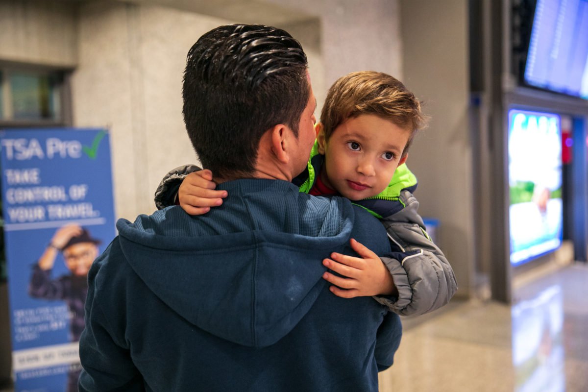 Julio holds his son Brayan, 4, at Austin-Bergstrom International Airport in Austin. (Ilana Panich-Linsman for ProPublica)