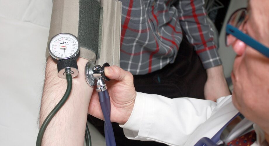 doctor taking blood pressure
