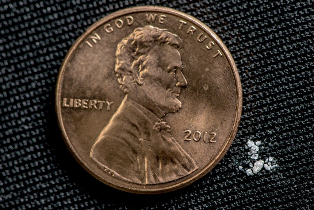 Photo illustration of 2 milligrams of fentanyl, a lethal dose in most people / DEA