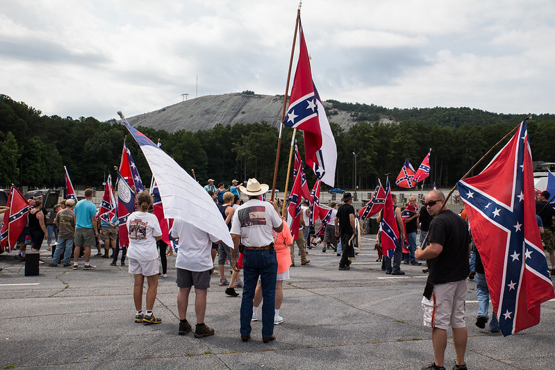 Why is the red and black flag, seen at rallies in support of