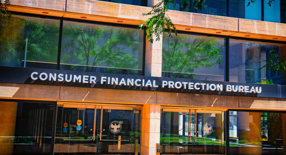 Exterior of the Consumer Financial Protection Bureau building with large glass windows and a sign reading ‘Consumer Financial Protection Bureau’ above the main entrance.